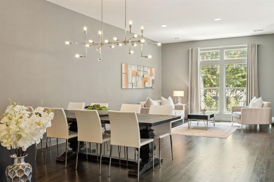 Step into modern luxury in Oak Lawn with this stunning Perry Home that perfectly blends style and convenience. Soaring high ceilings and floor-to-ceiling windows flood the open floor plan with natural light, highlighting the rich dark hardwood floors, designer paint, and elegant arch transitions throughout. The chef’s kitchen is equipped with Ken Moore cabinets, timeless granite countertops, a dramatic oversized island, and stainless steel appliances—ideal for entertaining. A beautiful hardwood staircase leads to spacious living areas, while the garage impresses with epoxy floors. Outside, enjoy your private patio oasis, all just minutes from the Katy Trail, American Airlines Center, Uptown nightlife, top hospitals, and easy highway access. A wired security system and gated yard add a sense of privacy. This walkable yet tucked-away community in one of Dallas' most loved neighborhoods offers the perfect blend of excitement and tranquility—come see why this home is the ultimate Dallas lifestyle upgrade!