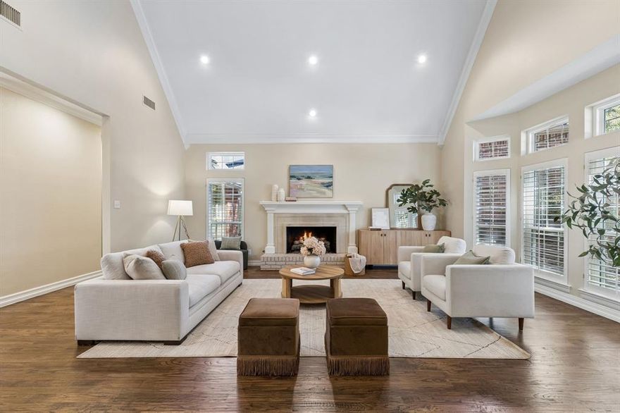 Tucked away on a quiet, tree-canopied cul-de-sac, this beautifully updated 4-bedroom, 4-bath home offers the rare feeling of country living in the heart of the city. Inside, you’re welcomed by rich hardwood floors, classic millwork, and a dramatic staircase that sets an elegant tone from the moment you enter. Designed for both everyday comfort and effortless entertaining, the home features generous living spaces, large bedrooms, and an ideal layout that includes a dedicated home office. At the heart of the home is a stunning, chef-inspired kitchen—fresh, bright, and thoughtfully finished. Crisp shaker-style cabinetry stretches to the ceiling for a clean, custom look, complemented by quartz countertops, brushed-gold hardware, and a bold herringbone tile backsplash that adds a designer edge. A gas cooktop and double ovens make hosting easy, while expansive prep space and a functional layout keep everything within reach. The kitchen opens beautifully to the living and breakfast areas, creating a natural gathering spot for family and friends. The primary suite is a true retreat, highlighted by a refreshed bath with spa-inspired finishes. Out back, enjoy a serene greenbelt backdrop—a peaceful view that elevates morning coffee, weekend gatherings, and evenings at home. Perfectly positioned just moments from neighborhood favorites, including the White Rock Creek Trail, Fair Oaks Tennis Center, shopping, dining, and DART access, this home delivers the best of Dallas living—private, connected, and beautifully upgraded.