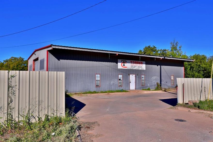 Excellent opportunity for a new or growing business! This property features a large garage shop attached to the main office, providing ample space for equipment, vehicles, or inventory. The main office building includes four private offices and three bathrooms, offering functionality and comfort for daily operations. Outside, you’ll find a detached carport-pavilion and a fully fenced lot with gated entry, ideal for security and convenience. Previously used as a construction business, this versatile property is ready to accommodate a wide range of commercial uses ideal for contractors, service companies, or light industrial use.