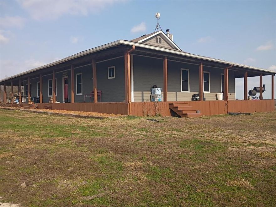 This modern farmhouse has everything you need for a small farm or ranch. 10 acres of ag exempt native pasture is fenced and cross fenced with a 3 stall loafing shed and nice size pond. Corner lot on a quiet county road with very little traffic you will find peace and tranquility sitting on your wrap around porch. No restrictions so you can add more houses plus have all types of animals here! Exterior of the home and porch freshly painted. Inside the kitchen are commercial grade appliances, a large island, walk-in pantry and plenty of cabinets. The master suite is heavenly with an incredible shower, dual sinks and huge closet. The children's suite consists of two bedrooms, a separate living room and ensuite bathroom. Another bedroom, full bath, game room and office make this house so versatile for any family. The wood plank floors, log posts, rustic tin ceiling and wood burning fireplace will make you want to live in the open kitchen and living area. Large mudroom with washer dryer sink and cubbies! Home has spray foam insulation including underneath. Multi changing eave lights around the house. Detached 3 car garage has room for a workshop, water heater, sink, spray foam insulation, split hvac system, covered deck, insulated garage doors, separate electric panel and meter, 220 outlets and led shop lights. If you have been thinking about moving to the country, this is the property you should see. Schedule your appointment today!