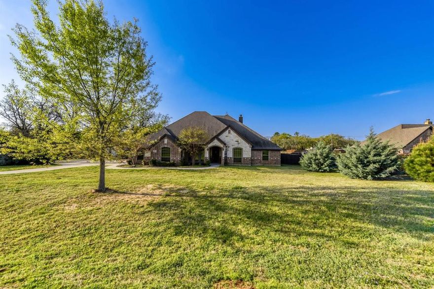 Set on a full acre in Boyd, this standout property delivers next level multi-generational living with the space, privacy, and versatility buyers rarely find. Surrounded by mature trees and wide open skies, it offers a peaceful, tucked away feel with room to truly live, while still being conveniently close to major roadways, local schools, shopping, and dining. Large homesites, quiet surroundings, and a true country atmosphere create a setting that feels like your own private retreat. Inside the main home, an open concept layout impresses with 10 foot tray ceilings, wood look ceramic tile throughout, and a warm, inviting living room anchored by a fireplace and custom built-ins. The oversized kitchen is built to gather, featuring a massive center island, granite countertops, and effortless flow into both the formal dining room and breakfast nook. A split bedroom design enhances privacy, highlighted by a spacious primary suite with a spa like ensuite offering dual sinks, a soaking tub, separate shower, and a generous closet. The 420 sq ft enclosed sunroom with an outdoor fireplace creates a year-round entertaining space overlooking the private backyard, complete with fencing on three sides and a tree lined rear boundary.  What truly elevates this property is the impressive 30x40 metal building with approximately 960 sq ft of additional living space, complete with 2 bedrooms, full kitchen, living area, full bath, and laundry.  This space would be ideal for extended living, guests, or income potential.  In addition to the 960 sq ft barn is another 2 story Accessory Dwelling 650 sq ft. or guests or income potential. (The square footage needs to be verified). This is more than a home, it’s a rare opportunity to own space, flexibility, and lifestyle all in one. Schedule your private tour today before it’s gone.

Discounted rate options and no lender fee future refinancing may be available for qualified buyers of this home.