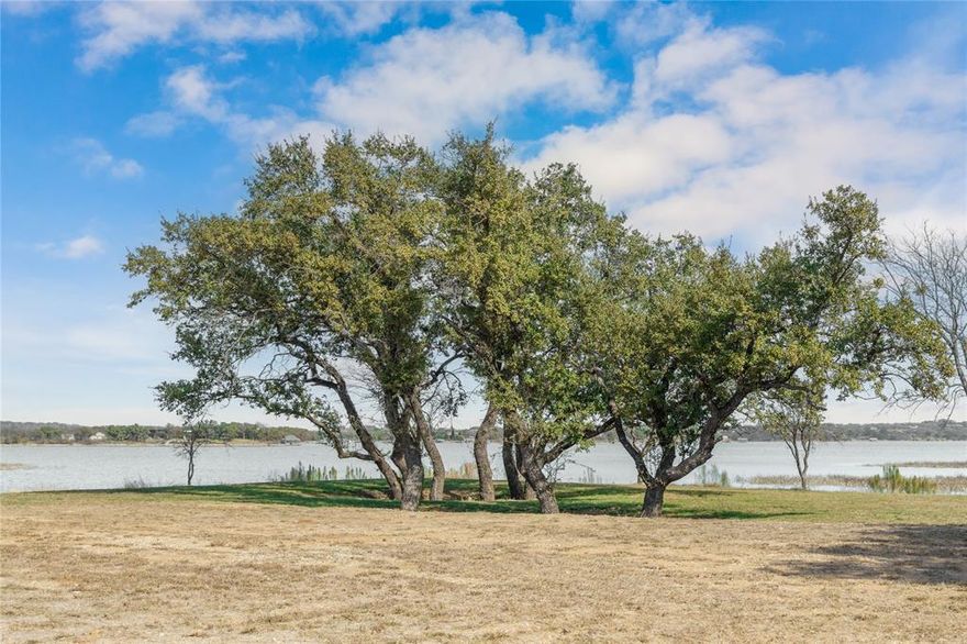 Stunning lakefront opportunity on Lake Brownwood. This beautiful lakefront property offers an expansive stretch of waterfront with over 1.6 acres of land. Docks are permitted, making it ideal for boating and lake living! This property is also equipped with electricity and water  ready to go, saving you time and expenses. The seller has a building pad or you may choose another scenic spot to build your dream lake home. Perfectly located near all the lakes activities and just a couple minutes from The Hideout, featuring golf, dining, bars, and guest lodging. Don't miss this opportunity to own over an acre and a half waterfront property on the Beautiful Lake Brownwood!