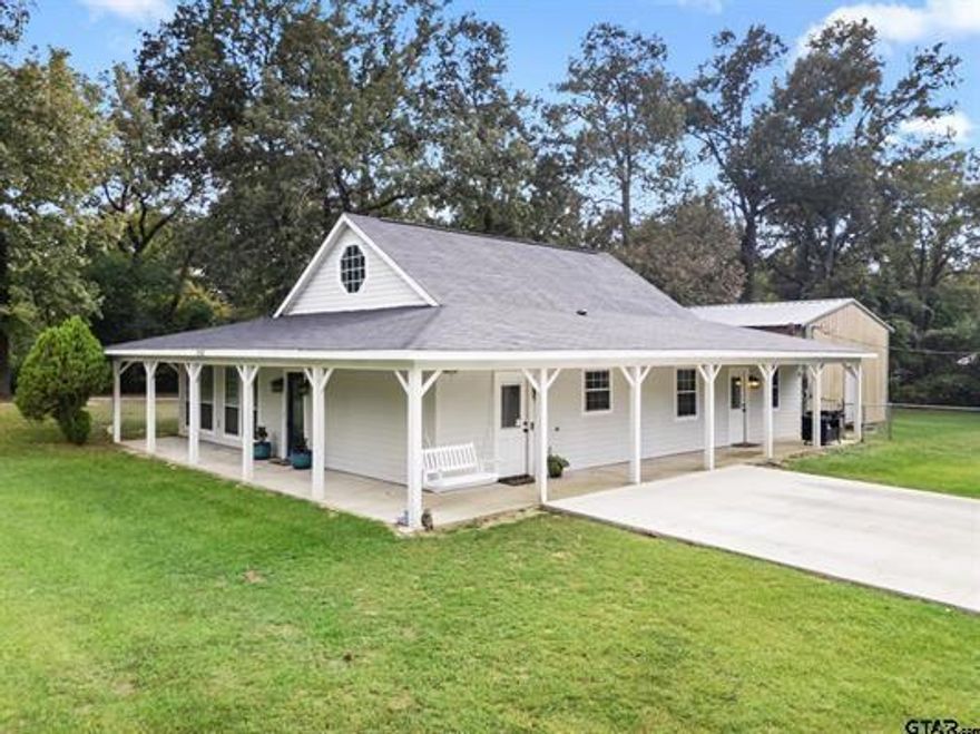 If  you are looking for a large one acre lot with an outstanding updated home and within five minutes to the public boat ramp on Lake Tyler East, YOU HAVE FOUND IT! This home is an open design with all the latest finishes: white cabinetry in the kitchen, black granite counter tops, Stainless appliances, walk in pantry, and a large breakfast bar. All open to the large dining area and family room. There is also a second living are or private office available. All bathrooms are updated. The primary bath has a huge walk in shower and a new tub! There is also a large dream shop right behind the house, tall ceilings and twelve foot doors. Other updates include: Concrete driveway redone with extra parking in 2025, new roof in 2024, new HVAC system in 2024, new Aerobic system in 2021, and a new hot water heater in 2025, plus bathrooms updated with new cabinetry and quartz counter tops.  DO NOT MISS SEEING THIS BEAUTY!  Offering plenty of room for a swimming pool or sport court.