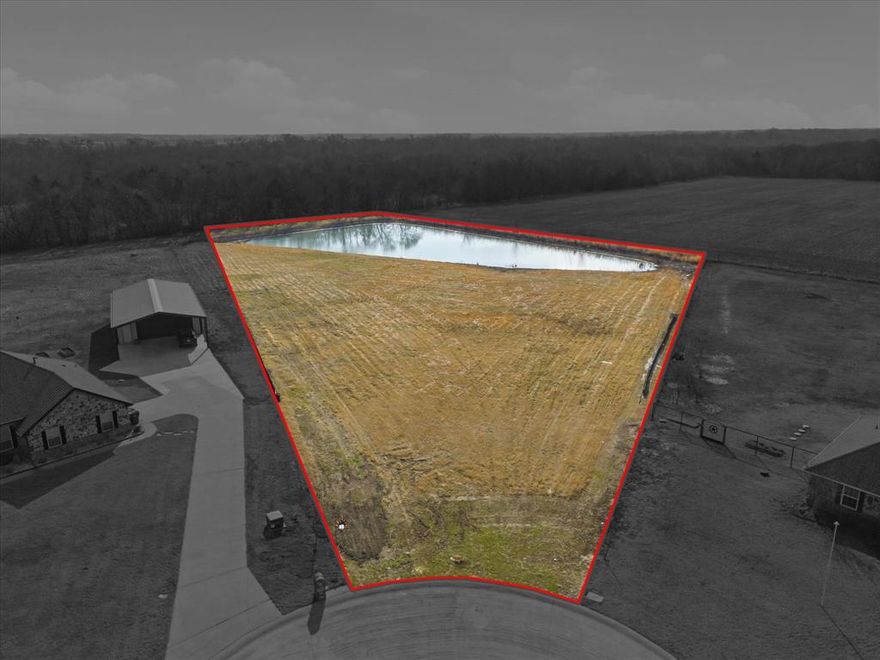 Your dream home site awaits! Just over 2.5 acres with a stunning 1-acre pond, offering the perfect backdrop to build your custom home. Situated on a quiet cul-de-sac lot, with trees, creating privacy and a serene country setting. Located in sought-after Caddo Mills ISD, this property offers the ideal blend of peaceful country living with convenient access to town. Enjoy the freedom of NO HOA and NO city taxes — bring your vision to life without restrictions. The water meter is already installed (a $3,500 value), and the seller has recently cleared saplings from the pond, saving you time and money. With ample space for your dream home, shop, outdoor entertaining area, and more, this property is the perfect blank canvas to create your ultimate retreat.