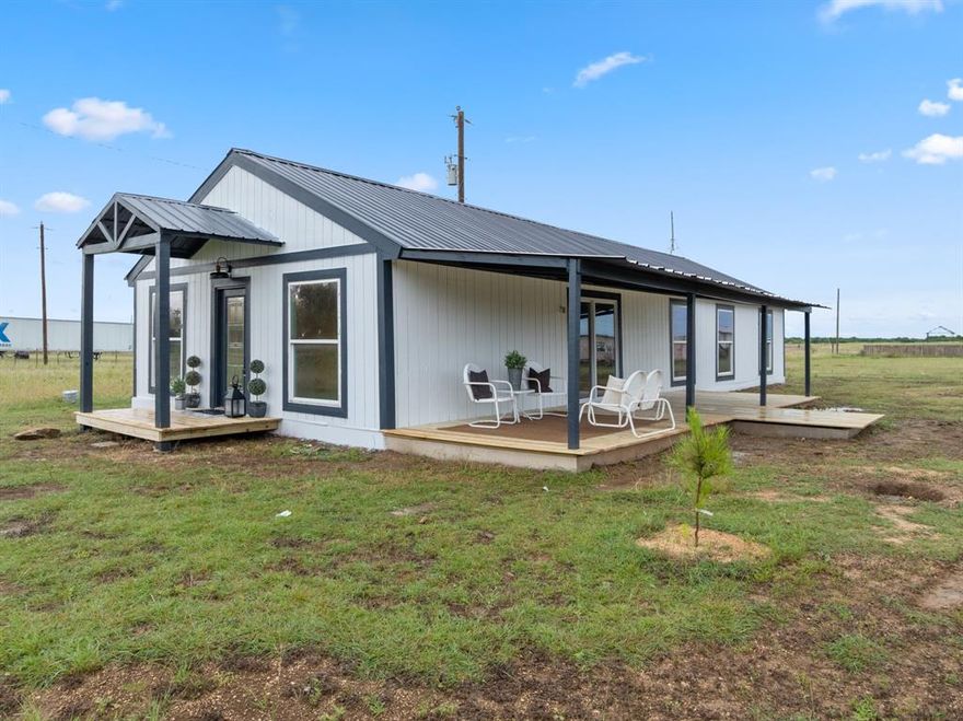 AFFORDABLE 5 bedroom HOUSE on 1 ACRE with room for everyone! Come live the relaxed, simple life outside of city limits with NO HOA and the freedom to raise farm animals. Let your kids run wild and bring your big dining table along with loved ones to this spacious, open concept layout where there's room for gathering inside and outside. You will love the abundance of windows allowing natural light in while enjoying views of country life.  Oversized 30ft side porch is made for relaxing in a shady spot on a breezy day.  Master retreat located at the back of the house with oversized ensuite bathroom and double closet. Newer built, freshly painted in and out, and new carpet in bedrooms.  Located conveniently between I35E & I 35W for quick and easy access to Dallas, Fort Worth or Waco!  Bring your horses! Wardrobes will convey.