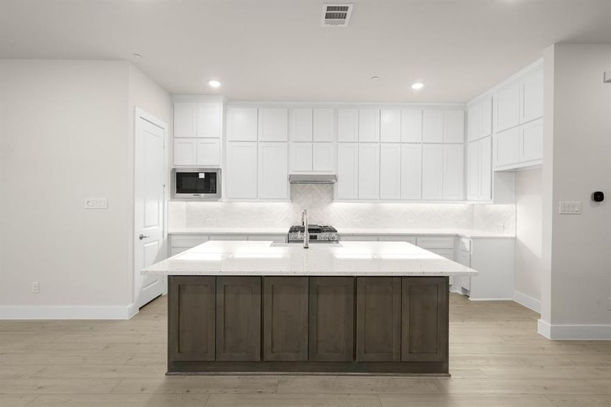 MLS# 21211759 - Built by First Texas Homes - Ready Now! ~ Located in The Abbey at Mercer Crossing- Farmers Branch, this thoughtfully designed townhome offers 4 spacious bedrooms, 3.5 bathrooms, and 2,535 sq.ft of flexible living space. This new construction home is the LAST remaining inventory home with a PRIME north-facing lot. The interior is everything you’d expect from a new construction home & more. It’s loaded with features including an electric fireplace, cabinets to ceiling, epoxy garage floors, vaulted ceilings, & design upgrades throughout!