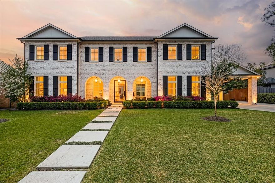 The Bird Streets 2 story home with 5 bedrooms, 5 bathrooms, 2 half bathrooms and a dedicated study, located just blocks from the Dallas North Tollway with quick access to Downtown Dallas, Dallas Love Field Airport and only 1 mile from all of the restaurants and shopping at Inwood Village and Highland Park Village. Built in 2021 and set on an oversized 105x160 lot, this residence brings together thoughtful custom design, expansive living space, and a location that can't be beat. The exterior immediately reflects the care that went into the design, with mature trees, arched architectural accents across the covered front porch, and a porte cochere leading to the 3 car garage. Inside, the entry introduces the home with herringbone wood flooring and an intricate wrought iron railing along the staircase. The main living spaces unfold around a spacious living room anchored by a fireplace and a wall of windows that bring in natural light while looking out to the backyard. The kitchen sits just off the living room and offers both generous workspace and gathering space, centered around a large island with breakfast bar seating along with quartz countertops, tile backsplash, shaker cabinetry, double ovens, a gas cooktop, butler’s pantry with an additional 2 refrigerator drawers and high end stainless appliances. The primary suite is located on the main floor with an ensuite bath that includes a walk in shower and a standalone soaking tub. Upstairs, 4 additional bedrooms each with their own ensuite bathroom. A large game room adds another gathering space for movies, games, or relaxing with friends and family. The backyard opens into a covered back patio, with a fireplace and grilling area, and a grassy yard with plenty of room to add a future pool. Additional upgrades include a water filtration system and a 24 kw home generator. Living in The Bird Streets places dining, business districts, and travel within easy reach while still enjoying the space and scale this home provides.