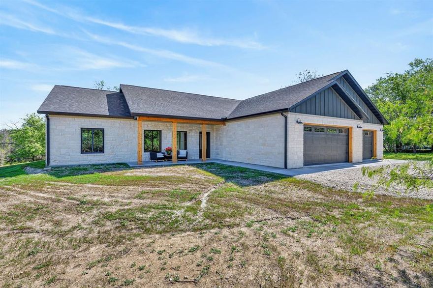 Discover this beautifully crafted new custom home located in the sought-after Whispering Ridge Development. This spacious 2,152 sq ft residence offers 3 bedrooms with the flexibility for a 4th bedroom, making it ideal for growing families, home offices, or guest space. The open-concept floor plan seamlessly connects the living room, dining area, den, and kitchen, creating a warm, inviting space perfect for entertaining and everyday living. 
Set on just under an acre, this home provides privacy, room to roam, and peaceful surroundings. The Austin Stone exterior adds timeless curb appeal and quality craftsmanship. A rare oversized 3-stall garage offers 1,033 sq ft of space, plus an additional 312 sq ft of overhead storage, perfect for vehicles, hobbies, tools, or extra storage needs.  Call to see this fabulous home now! Currently listed below tax appraisal value.