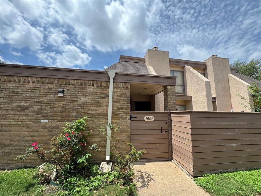 This 2 bed, 2 bath Dallas condo is the one you have been waiting for! Prime location near the airport, major freeways, and great shopping. Inside features a cozy brick fireplace, wood laminate floors, and a smart layout that is perfect for entertaining. Full bed and bath on each level, large closet upstairs, storage galore, and a private patio out back. Assigned parking, guest parking, and the pool is right around the corner. Move in ready!