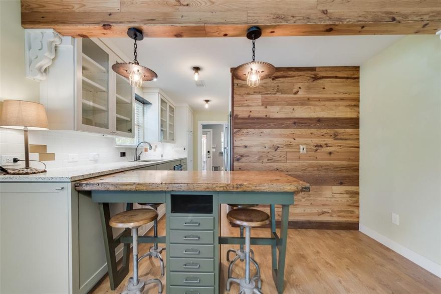 ***Country living minutes from the city*Fabulous like NEW home tucked away in the sought after community in Downtown Cedar Hill*This home was gutted down to the studs in 2014 and completely built back with modern upgrades including electrical, plumbing and HVAC while maintaining vintage charm*So many unique finishes and touches found here will convey with the home*Outside you will find a backyard built for fun with a gigantic covered back porch, TV cabinet for game night with the guys, dart board, flagstone pathway leading you to the fire pit and don't forget to check out the GREENHOUSE*This 2 bedroom house could easily offer an additional 180 square feet of space for your HOME OFFICE or shop right off the garage, perfect space for privacy*Two additional storage spaces behind garage*COMPLETELY CUSTOM home has original characteristic but feels like new*Just a few of the perks you'll find inside are foam insulation, large walk in closets, nest thermostat, security cameras, surround sound wiring, modern kitchen and bathrooms & ALL APPLIANCES STAY*Your view from the front porch won't disappoint with a pasture and no neighbors in front of you*This home is perfect for those looking to downsize, first time home buyers or anyone looking to simplify their lifestyle***