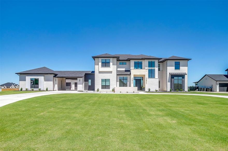 1% BUYER CREDIT when financing with preferred lender!  Welcome to this JAAVA Custom Home, where timeless design meets modern sophistication, located in the highly desirable Bella Crossing community within Aledo ISD. Recently completed in June 2024 and barely lived in, this like-new estate offers over 4,700 square feet of expertly crafted living space in the main residence, plus a separate 1,400+ square foot guest home—perfect for multigenerational living or extended-stay guests. Step inside to find European white oak flooring, soaring ceilings, and a seamless blend of warm, natural finishes with contemporary design elements. The heart of the home is a chef’s dream kitchen featuring top-of-the-line Thermador appliances, custom cabinetry, an oversized island, and a separate butler’s area with additional sink and hidden pantry —ideal for both everyday living and entertaining.  The main home includes four spacious bedrooms, each with its own en-suite bathroom, along with two additional half baths. The primary suite, located on the main level, offers a spa-inspired bathroom with a soaking tub, luxury shower, dual walk-in closets, and private patio access—creating a serene retreat. A dedicated home office with floor-to-ceiling built-ins combines style and functionality, while upstairs you’ll find two additional bedrooms, a game room, a media room with whole-home wired AV closet, a flex space ideal for a gym or second office, and a dry bar. The guest residence mirrors the quality of the main home, offering two bedrooms, two bathrooms, a full kitchen and walk in pantry, laundry room, and its own private covered porch.  Home has 2 separate garages, a 3 car and a 2 car, split between a motor court. This is a rare opportunity to own a meticulously designed, move-in-ready custom estate in one of the area's most prestigious communities.  Pool is virtually staged.  Pool rendering with quote available upon request.