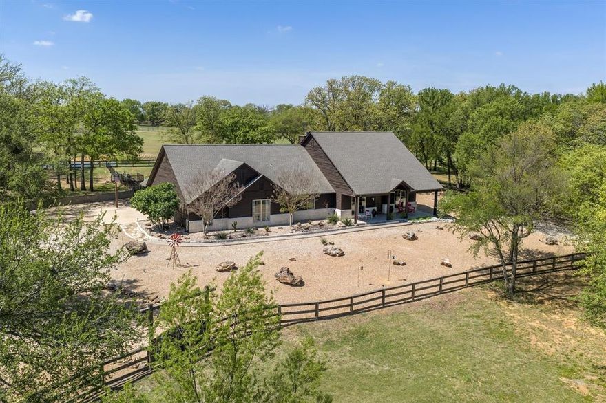 Welcome to 2431 Dr. Sanders Road in the heart of Aubrey, Texas. A perfect blend of comfort, space, and country charm. Nestled on a generous 20 acre lot, this beautiful property offers the peace and privacy of rural living while still being conveniently close to shopping and dining. Step inside to discover a thoughtfully designed layout featuring spacious living areas, abundant natural light, and stylish finishes throughout. One of the home’s most captivating features is the view. Enjoy scenic surroundings from every room, creating a bright, open feel and a constant connection to the beauty of the outdoors. The kitchen serves as the heart of the home, offering ample counter space, stainless steel appliances, and a seamless flow into the dining and living areas, ideal for both everyday living and entertaining. The primary suite provides a relaxing retreat with a well-appointed ensuite bath, plenty of closet space, and tranquil views to start and end your day. Additional bedrooms are generously sized, each offering their own inviting perspective and flexibility for family, guests, or a home office. Equestrian enthusiasts and hobbyists alike will appreciate the impressive 20,000 sq ft barn, complete with an indoor riding arena, a fully equipped shop, bonus space with a bathroom, and a dedicated tack room. The property also features an outdoor arena, providing the perfect setup for training, riding, or hosting events. Adding even more value, the property benefits from an AG exemption, offering potential property tax savings while supporting agricultural use. Outside, enjoy wide-open Texas skies from your backyard perfect for relaxing evenings, weekend gatherings, or simply soaking in the serene surroundings. With plenty of room to grow, this property offers endless possibilities. If you’re looking for a place where every window brings in a view, and where exceptional equestrian amenities meet peaceful country living, this is the one.