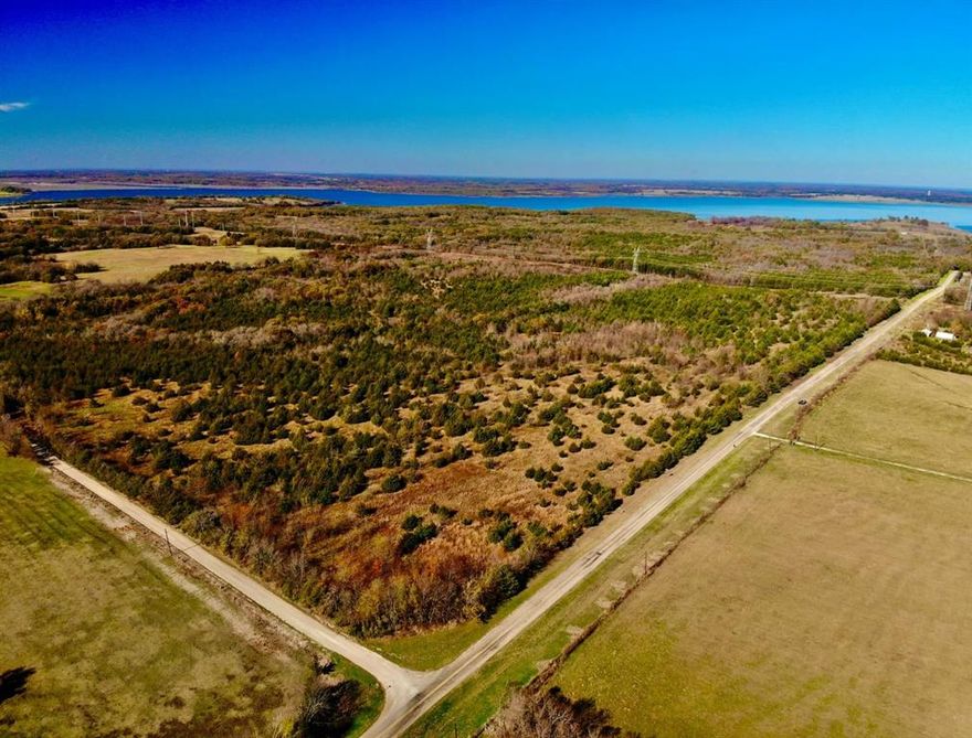 Rare Opportunity to purchase 5 acres of hard-to-find land near the brand-new Bois D Arc Lake. With the lake estimated to open in 2024, secure your property while it is still affordable. Bois D'Arc Lake Estates is offering introductory pricing on the first 10 lots sold before prices are raised 40% on the remaining 14 parcels. Beautiful, scattered hardwood trees on nice roads close to the public boat ramps on FM 897. Water is now available along FM 1743 parcels and will be extended to all parcels soon. These lots fall into the new lake zoning of 5-acre minimum parcels. 24 parcels in total are being offered in 5- and 10-acre configurations. TX.D.O.T. culvert permits have been submitted, and Water Will-Serve letters are in-hand. Septic is required. Lake is about 90% full and opens to boats soon. The lots are on the FUN side of the lake designed for recreational boating. Owner Lending, 15% Down, 10% Interest, 5 Year Note.  Purchase of this tract will come with a new 30x30x12 metal shop. Includes delivery and installation, but no concrete foundation is included.