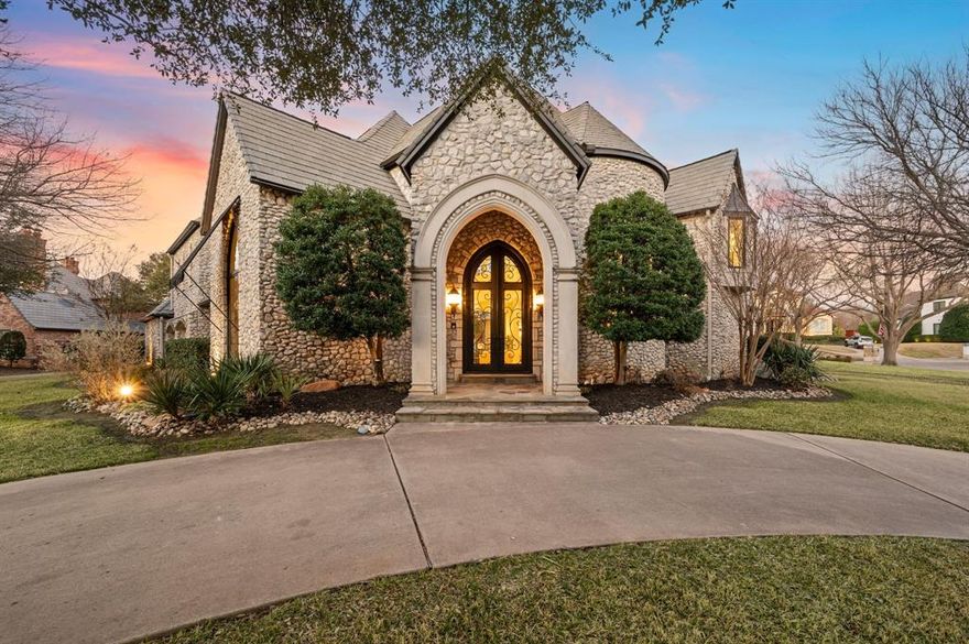 Welcome to this stunning, MOVE-IN READY luxury estate with 4 car garage situated on an exclusive half-acre corner lot in the prestigious 24-hour guard-gated community of Montclair Parc. Ideally located just minutes from Southlake Town Square, Downtown Historic Grapevine and DFW Airport this incredible home has it all! From the moment you enter the grand wrought-iron staircase, soaring vaulted ceilings and expansive windows create a breathtaking first impression, filling the home with natural light. Designed for elevated living and effortless entertaining, the first floor offers multiple living and dining spaces, an impressive media room, a walk-in wine room, dual butler’s pantries and a spacious laundry room complete with built-ins and a pet shower. The chef’s kitchen is a true showpiece, featuring gorgeous quartz countertops, a built-in refrigerator, chef-style gas cooktop and an oversized island. The private primary suite is thoughtfully located on the main level and showcases a wall of windows overlooking the sparkling pool, a cozy double-sided fireplace, and an expansive custom walk-in closet with built-in shelving and vanity. The spa-inspired primary bath includes a soaking tub, built-in desk and a luxurious oversized shower with multiple shower heads for a true retreat experience. Upstairs you will enjoy a spacious game room with wet bar, a dedicated office with custom built-ins, and a generously sized secondary primary suite, ideal for multigenerational living or extended guests. Step outside to your own private resort. The covered patio overlooks a spectacular pool with a swim-up bar, while a charming bridge leads to a covered entertaining space with a fireplace. A built-in grill completes the outdoor living experience, creating the perfect setting for unforgettable gatherings year-round. You don't want to miss your chance for luxury and resort-style living, all in one remarkable property.