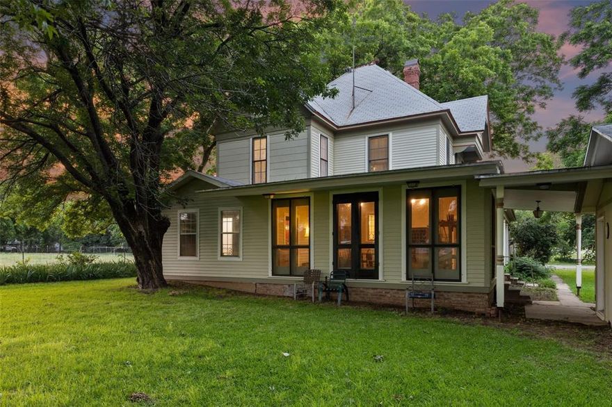 Exquisite 1894 Victorian Farmhouse on Expansive Acreage in Historic Pilot Point. Step into a piece of history with this meticulously restored 3-bedroom, 2-bathroom Victorian farmhouse, originally constructed in 1894. Nestled in the heart of Pilot Point, this three-story residence spans 3,294 square feet and is set on 6 picturesque acres, making it an ideal haven for equine enthusiasts. The home showcases: Original hardwood floors throughout, exuding timeless elegance. Imported Parisian Schumacher wallpaper and numerous original fixtures, preserving its historic charm. A modernized kitchen featuring abundant white cabinetry and classic black granite countertops. Four generous living areas and a spacious dining room, perfect for gatherings. A 390-square-foot glass-enclosed patio, serving as a delightful family room. Additional highlights include two decorative (non-working) fireplaces, a grand staircase, and recent updates such as a 2024 roof, reinforced foundation piers, updated electrical wiring, double-pane wood windows, and custom solar shades. Own this exceptional blend of historic beauty and contemporary comfort. Don't miss the opportunity to make this unique property your own. An addition adjacent 2 acres available