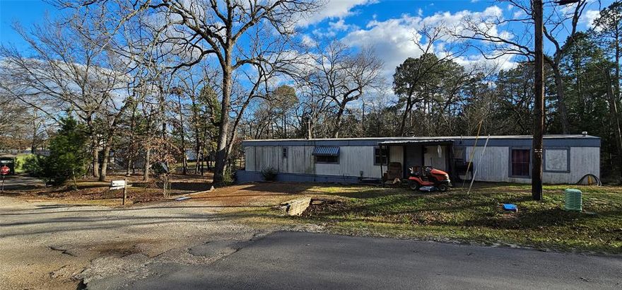 INVESTOR OPPORTUNITY – Rare chance to acquire four lots for the price of one in the gated Hickory Hills HOA on Callender Lake in Murchison, TX. This corner property includes a 2-bedroom, 2-bath mobile home with lake views and road frontage on all four lots. Property is currently occupied. 
The home needs repairs and is being sold as-is, making it ideal for investors, flippers, or developers. Keep and renovate the existing home, or remove the home and split into four individual buildable lots — strong upside potential either way. This Subdivision allows for Tiny Homes, RVs, Mobile Homes are all allowed. HOA amenities include private gated access, private boat ramp, swimming pool, park, and large pavilion. Property features a fenced backyard, storage building, large tornado shelter, and wood-burning stove in the living area. Road access is solid, utilities connected, and the rear of the property offers mature trees with a creek running behind all four lots, adding value, privacy, and drainage. Lake-area demand plus gated access makes this a strong long-term hold, flip, or resale play. Priced for condition and potential. Bring offers.