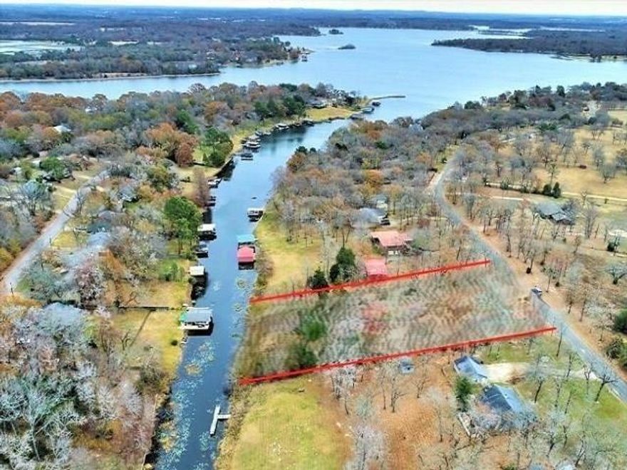 Extra Wide Lake Lot!! This lot is approx. 190 ft. wide which is rare find on Lake Athens. The lot has approx. 204 ft. of shore line. 1.32 Acres of waterfront property. Cleared & trimmed trees, ready to build. Pad started, have soil testing report, survey & dredging permit. This is in the county, outside the city limits. A septic and well will be needed. Survey available. This is a lot and a half, both #257987 from the county. Please see the CAD WEB MAP.
