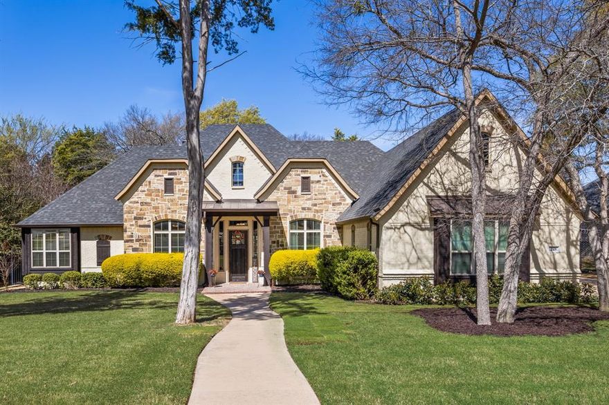 THIS IS THE MIDLOTHIAN ISD HOME YOU HAVE BEEN WAITING FOR! Nestled back in beautiful Ovilla Parc Subdivision, this home has everything you need if you want stunning decorator touches, upscale features, lots of space to entertain large groups, a peaceful and calm view out of every window you look, and a home that has been loved and maintained to the highest of standards. You will have to see it to understand how stunning this property is! Entering the front door, you immediately notice the architectural details in the study and living room: coffered ceilings, custom wood shelving, handscrapped wood floors, stone gas powered fireplace with wood mantle, and the stunning view of the backyard living space. The kitchen is gorgeous with everything you need to entertain and wow your guests: beautiful decorator touches such as coffered ceiling, lighted top cabinets, high-end tile backsplash, custom wood vent, all brought together w the oversized granite island w seating. Double ovens, tons of cabinets and counter space, a large walk in pantry, and oversized dining area make it functional and beautiful! Other main highlights of the interior are: the private, oversized primary bedroom w a back yard view out of the bay window sitting area and his and hers closets, wainscoating, a 2nd living room, two secondary bedrooms join at the Jack and Jill bath w double sinks and private door to the shower and toilet area, the third secondary bedroom has easy access to a separate full bath, large utility, and spacious mud room area. THE OUTDOOR SPACE is what knocks this property out of the park! 336 sf of covered patio w a stone fireplace and brick patio, PLUS another 1023 sf of an open air patio that includes a 14 ft X 8 ft plunge hot tub pool combo. 1,359 sf of outdoor living space w a beautiful, hilly tree filled, peaceful view on this .75 acre property equally matches the beautiful interior. So much love and care has been put into this beautiful custom home! Come see it for yourself!