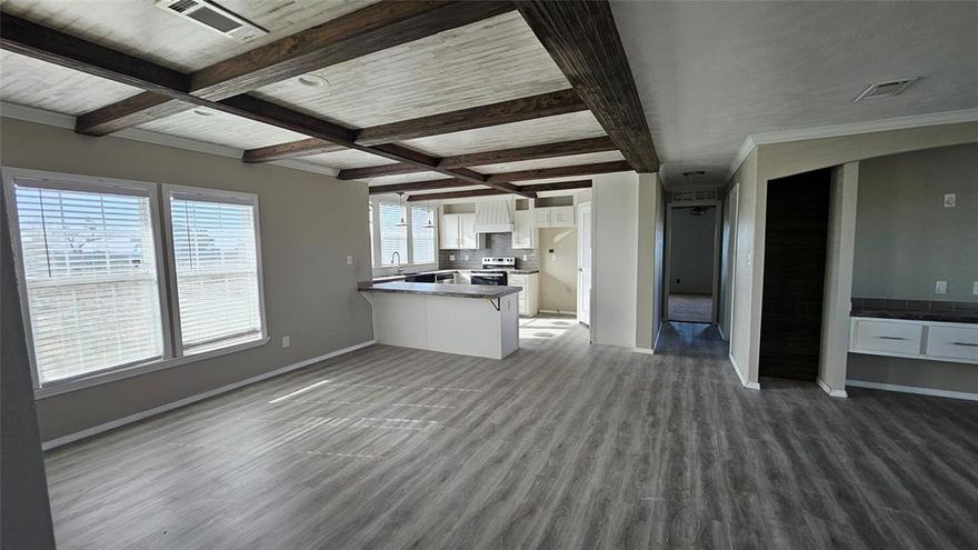 2018 Southern Energy manufactured home situated on 1 acre in Blanket ISD, offering a peaceful country setting. This 4-bedroom, 2-bath home features approximately 1,980 sq ft of living space with a functional and open layout.

Interior highlights include ceiling-mounted AC vents, architectural archways, exposed ceiling beams, built-in cabinetry, and ceiling fans throughout. The kitchen is equipped with a farmhouse sink, center island, and pantry, providing ample storage and workspace.

The primary bathroom includes a separate tub and shower. Additional features include smart panel siding and a dedicated dog wash, adding convenience and practicality.

Located in a rural setting with room to enjoy outdoor space while remaining within the Blanket Independent School District.