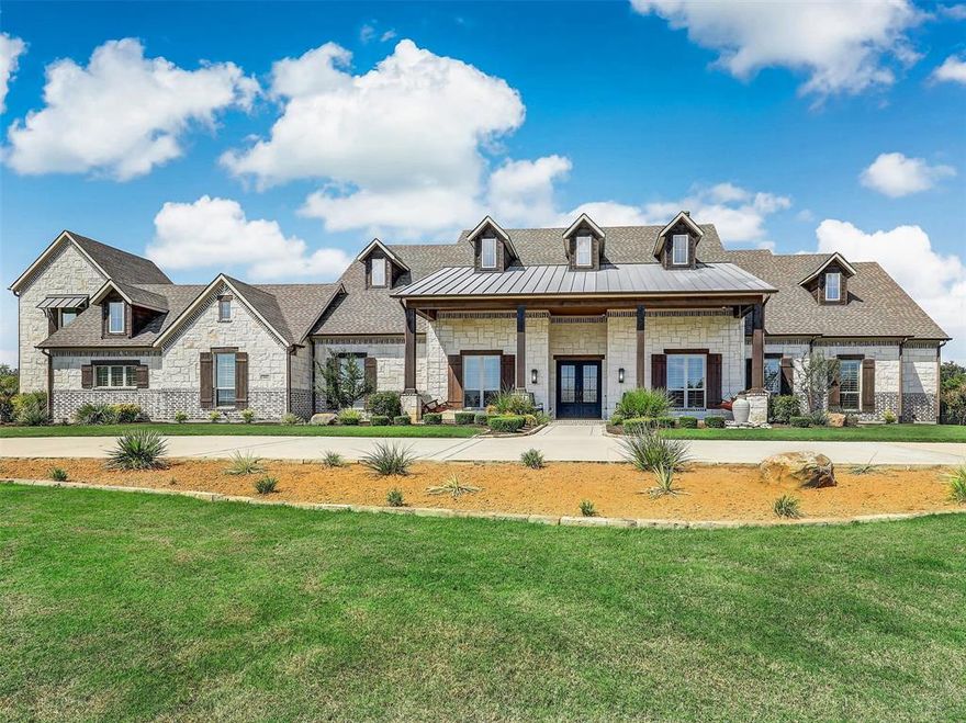 Beautiful single story home in prestigious Whispering Farms! This custom Dave Williams home sits on 1.35 acres! Inside are 5 bedrooms, 5.1 baths, study, game, media and 2nd master! Magnificent and open great room with custom kitchen and wall of windows with view of landscaped courtyard! Gourmet kitchen has dual ovens and dishwashers, gas cooktop and oversized pantry! Luxurious master with exercise room and private patio! Guest wing has gorgeous game room and bar; media room with projector and screen! Guest bedrooms with private baths. Wood floors throughout! Landscaped yard, outdoor kitchen, circular drive, courtyard and more! 4 car garage with built ins and lift to 400+ sf Texas Basement! A Texas treasure!