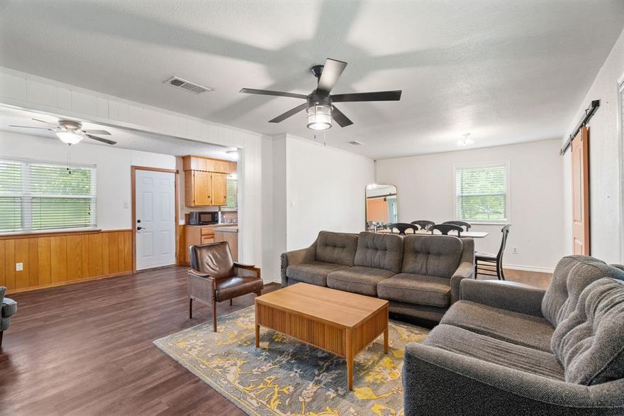 *** 5K credit to buyers with an acceptable offer *** Discover the perfect blend of rural tranquility and modern convenience in this well maintained 3-bedroom, 2-bathroom home set on a spacious .663-acre lot. Nestled in the serene landscapes of Greenville, Texas, this property offers an inviting retreat with ample room for outdoor activities and relaxation amidst nature's beauty.

**Interior Details:**

Step inside to a welcoming open-concept living area that maximizes space. The living room features warm, neutral tones and is designed for comfort, offering a perfect spot for quiet evenings or entertaining guests. The adjacent kitchen is equipped with plenty of counter space and ample cabinetry for all your culinary needs. A cozy dining area completes this heart of the home, ideal for hosting meals.

The primary bedroom provides a peaceful sanctuary with an en-suite bathroom for added privacy. Two additional bedrooms afford flexibility for a home office, guest room, or hobby space, each offering access to a second full bathroom.

**Exterior Details:**

Step outside to your expansive .663-acre lot, where mature trees provide shade and enhance the natural beauty of the property. The sprawling yard offers endless possibilities for creating a garden oasis, outdoor play area, or additional living spaces. Although there is no garage, ample space is available for parking and future building opportunities. The rural setting ensures a sense of peace and privacy, while still being conveniently close to local amenities and schools.

This Greenville gem invites you to experience authentic country living with all the modern comforts in a tranquil and picturesque setting. Whether lounging under the shade of a tree or hosting gatherings in the vast outdoor space, this property is a dream come true for those seeking both tranquility and convenience.