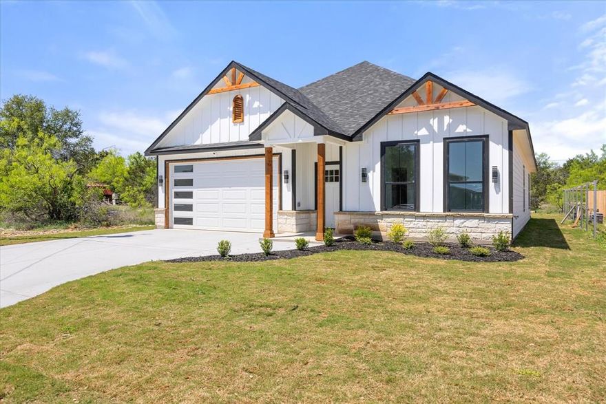 Discover your dream home in the vibrant and growing community of Comanche Cove, where modern design meets relaxed lake life. This brand-new 4-bedroom, 2-bath home features an open-concept layout, stylish contemporary finishes, and a light-filled living space perfect for gathering with family and friends. The kitchen is designed for both everyday living and entertaining, with sleek details that make cooking a joy. Just minutes from downtown Granbury, you’ll enjoy access to Lake Granbury amenities - including boating, fishing, a community pool, and scenic walking areas - ideal for weekend fun or quiet evening strolls.