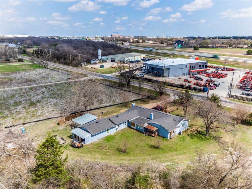 INVESTMENT OPPORTUNITY! CASH ONLY  Highly sought after, fast growing area! Great location with access to Highways 35 and 287 Business! With over an acre of land this could be a great property to build your retail space or any business! Property is zoned residential but could possibly be changed to commercial. Property has been renovated over several years and with different owners. Sellers have no knowlege regarding the renovations   done prior to their purchasing the property. The large living room with the vaulted ceiling was once a garage and then converted into a living room. There was a fire in the living room area in 2016. Permits were required for the new construction in that area of the house. The electrical work from the living room to the master bathroom along the front half of the home was replaced and has a new electrical box. The dining room, sitting area with stone fireplace and the eat-in kitchen area all have hardwood floors. The dishwasher and microwave do not work. The front half of the home has HVAC and the back half of the house has a window unit. The heat on the window unit does not work. There are also two electric water heaters in the home. The water heater for the back half of the home was recently replaced. The the gameroom and the hallway to the back half of the home have stained concrete floors. The laundry room, bathroom and three bedrooms in that part of the home were once a three car garage. The sub-panel to the back half of the home is located in the middle bedroom. There is damage to the ceiling in the gameroom, some broken window panes throughout the home, and some damaged area's of flooring throughout the home. There is a well on the property but the seller does not use it. The gravity-fed septic system has three tanks, one of which is an overflow. There is a pool on the property that was filled in and buried prior to the sellers purchasing the home. Dining room table is for sale.
PROPERTY IS BEING SOLD AS IS, NO REPAIRS.