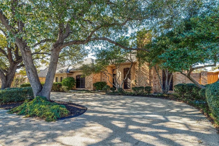 Beautiful light filled home in desirable Prestonwood Creek! Situated on a landscaped lot with lovely mature trees, this inviting property offers a versatile floorplan with updated amenities throughout the home for all the comforts of an urban lifestyle. Enter into the welcoming grand living room with soaring ceilings and paneled walls, great for art or media, featuring a fireplace and convenient wet bar. This room flows into the formal dining room, providing the perfect combination space for festive entertaining. For more casual gatherings the spacious island kitchen has a nice open area for an additional dining and includes a built in hutch. The flexible split floorplan offers a great second family or game room with a wall of builtin storage. This separate living area is adjacent to 3 bedrooms and 2 full baths that work as office or guest accommodations. The private primary bedroom has an ensuite bath with spa inspired shower, separate vanities and walk in closet. The home wraps around a covered patio with a side and back yard. Recent updates include a new digital security system, Nest thermostats, new water heater and HVAC 2025, new Rainbird sprinkler control panel, and a Tesla charging station in garage. Fantastic North Dallas location in RISD, with nearby shopping and restaurants.