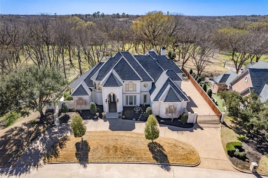 Freshly painted and move in ready.  Updated HVAC, tankless water heater, oversized garage. Luxury living at its finest on one of Timarron's most coveted streets. Nestled on over an acre of land, this stately custom home boasts privacy and stunning views. Renovated in 2004, every inch meticulously crafted, from the beautiful wood cabinetry to the elegant marble floors. Five bedrooms featuring ensuite baths, including a relaxing master retreat.   Entertain effortlessly in the gourmet kitchen, while the downstairs game room and bar offer endless amusement. Upstairs, kids will delight in their own domain with a movie room and bonus space. Outside, enjoy resort-style living with a sparkling pool, spa and outdoor lounging areas. See the impressive list of updates and improvements in the TransactionDesk.  Community features include walking paths, playgrounds, pools, tennis and pickleball courts.