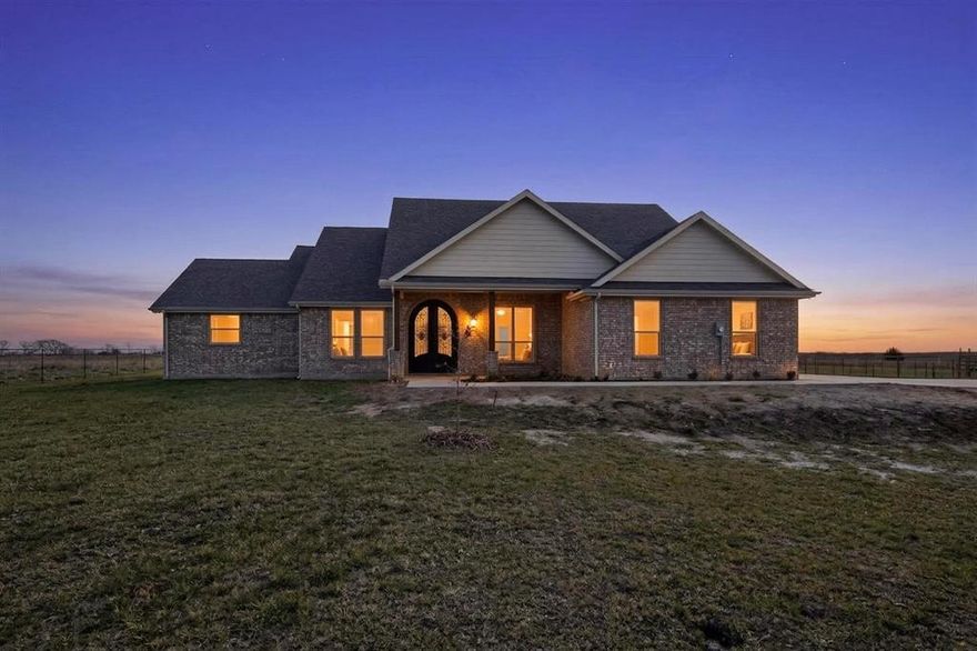This beautiful new home is nestled on an acre in the desired Leonard ISD with no HOA. Designed for natural light, featuring numerous windows and a seamless flow from the vaulted 12-foot ceiling living area to an open-concept kitchen and dining space. The kitchen showcases all-white cabinetry, a beautiful chandelier & luxurious backsplash, stainless steel appliances, ample custom cabinetry, quartz countertops, and a chef's walk-in pantry. The master suite offers a decorative two-sided fireplace, dual vanities, and a huge walk-in closet with room for a safe. The second primary bedroom is located on the opposite side of the other bedrooms for utmost privacy. Each bathroom is thoughtfully finished with quartz countertops. Custom LED exterior lighting, cedar garage door with concrete driveway, and fully fenced front & backyard with 2-inch metal tubing fencing. An electrically controlled gate was recently installed, adding extra security.  The expansive backyard is perfect for creating an outdoor oasis, with space for a swimming pool and plenty of grass for play. Relax on the covered front or rear patios. Conveniently located only 12 miles from Blue Ridge & 30 miles from McKinney, this property is a must-see!