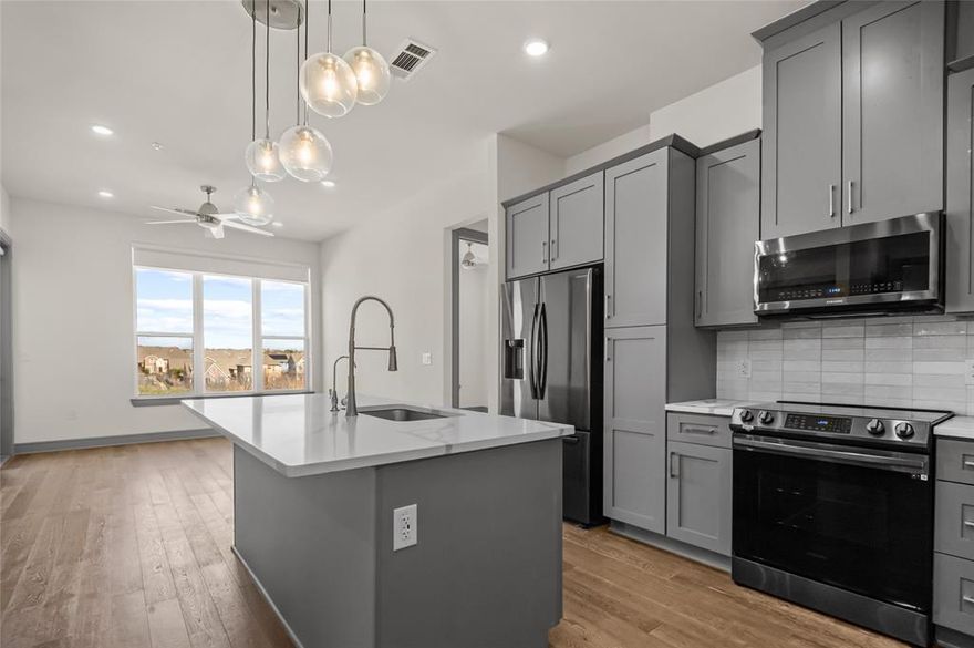 Enjoy breathtaking sunset views from your private balcony in this sophisticated upper-level condo. Overlooking Carrollton’s serene nature trails, this 2-bedroom, 2-bath residence perfectly blends modern style with luxury amenities. The gourmet kitchen boasts European-style cabinetry, quartz countertops, a designer tiled backsplash, and premium stainless steel appliances—all flowing seamlessly into an airy, open-concept living space.

Retreat to the primary ensuite featuring dual sinks, quartz counters, an oversized walk-in shower, and a spacious walk-in closet. Residents enjoy exclusive access to a resort-style clubhouse with multiple lounges, a sparkling pool, and a fully equipped fitness center. Located minutes from I-35 and PGBT, you’re perfectly positioned for easy access to DFW Airport, shopping, and dining. Refrigerator and stackable W&D included!