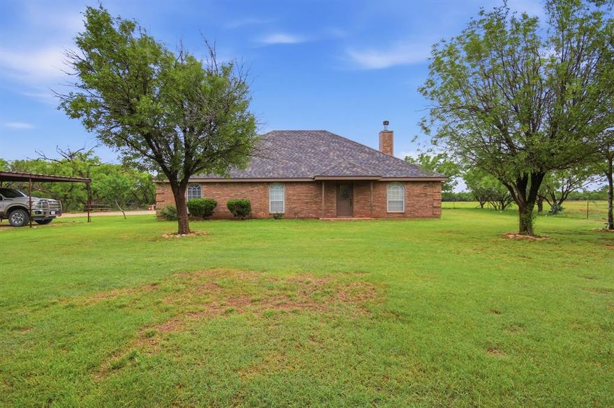 Welcome to this beautiful 4-bedroom, 2.5-bath home located in Merkel, Texas—where country living meets comfort and style. Surrounded by peaceful surroundings, this home offers space, charm, and functionality for everyday living.
Inside, you’ll find large windows throughout that fill the home with natural light, creating a bright and inviting atmosphere. The living room features a cozy wood-burning fireplace, making it the perfect place to relax or gather with family and friends.
The kitchen is designed with both style and practicality in mind, offering an eat-at bar area, a kitchen island, and plenty of cabinet and counter space—ideal for cooking, entertaining, or casual dining.
The primary retreat is a true standout, featuring its own private fireplace for added warmth and charm. The ensuite bathroom includes dual sinks, a soaking tub, and a separate shower, creating a relaxing space to unwind.
The additional bedrooms are all spacious and versatile, perfect for family, guests, or a home office setup.
Step outside to enjoy a covered back patio, a fire pit area for gathering under the stars, and even a hot tub, perfect for unwinding after a long day. A water well adds both convenience and value, while a storage shed provides extra space for tools and equipment.
This home offers the perfect blend of space, comfort, and country charm—ready to welcome its next owners!