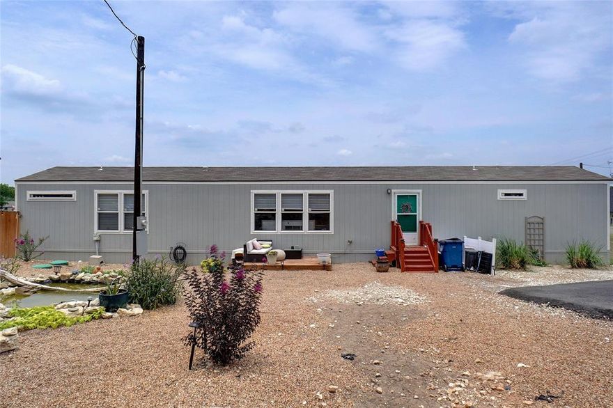 Great 3 Bedroom 2 Bath Manufactured Home with circle drive and fenced backyard.  Open Concept, Kitchen with Breakfast bar. Island and Farm Sink.  Priced well below market to allow for cosmetic repairs. Can be purchased with two other properties.  See photos and MLS 20364872 and 20366010