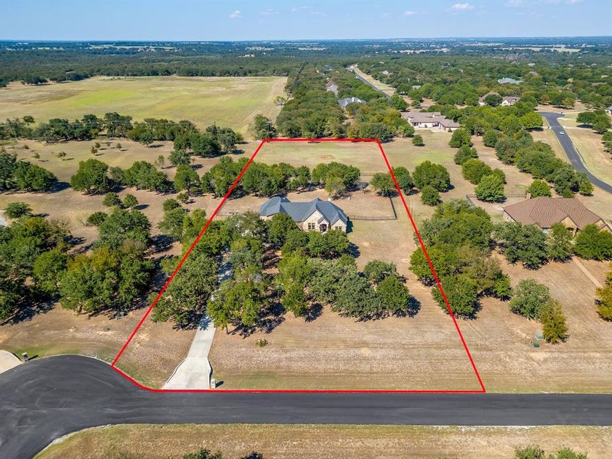 Opportunities like this don't come around often. Over 3 acres in Sugartree with city water and a private well! This nearly 3600 sq ft. custom home offers 4 bedrooms, 3.5 bathrooms, an oversized laundry room, and an extra large 3 car garage. Step through the double doors entry into the soaring cathedral ceilings accented with gorgeous wood beams. The open concept floor plan flows seamlessly, creating the perfect space for living and entertaining.The kitchen, living and dining areas are designed for both functionality and style, making this home a true showpiece. Enjoy the outdoors with a partially fenced large backyard, expansive covered patio and plenty of room to create your own private retreat. Sit back and watch the wild life roam while having a glass of wine or sipping on your morning coffee. Don't miss your chance to own a rare 3+ acre property in Sugartree. Schedule your showing today!