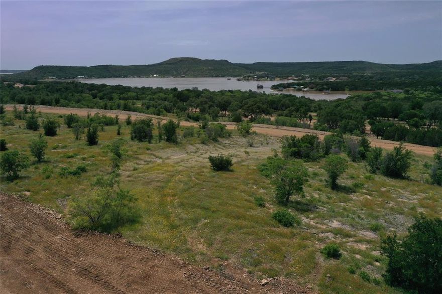 Build your lake getaway on Lot 126 White Moon Road in Clearwater Point at Possum Kingdom Lake

Lot 126 White Moon Road offers just over half an acre in the up-and-coming Clearwater Point community on the west side of Possum Kingdom Lake, known as one of the best lakes in Texas.

This property features incredible lake views that stretch across the water and surrounding landscape, making it the perfect setting for your dream retreat. The gated community is designed for relaxed, resort-style living with planned amenities including a pool, pickleball and basketball courts, a putting green, pavilions, and outdoor recreation areas.

Residents will enjoy private paved roads ideal for walking, biking, jogging, and golf cart rides. Underground electricity and co-op water will be installed at the front of each homesite.

In addition to stunning views of the lake and Palo Pinto Mountains, the community allows short term rentals and offers the potential for private boat docks and a community boat launch.

With restaurants and modern conveniences just a short drive away, this lot is a rare opportunity to invest in lake living at its finest.