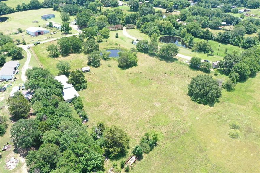 Bring your imagination to this rare 4-acre cul-de-sac property, full of opportunity and ready for your vision. This versatile tract is already equipped with an 80' x 30' metal building with attached covered carport, a 10' x 24' shed, pond, water meter, electric, and septic system, making it ideal for immediate use or future development. Located in Mabank ISD, this property is perfectly suited for agriculture, hobby farming, or creating your dream estate. Enjoy a peaceful setting with convenient access to Cedar Creek Lake and major routes toward Dallas, Tyler, and Canton. Buyers have the flexibility to purchase the entire 4 acres or consider smaller 1-acre parcels if preferred. (Reference MLS# 21216343, 21216321, 21216352, 21216383)