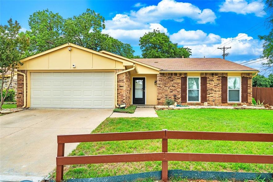 Just in time for Summer! This cozy 3 bedroom home has been beautifully updated and ready for new owners. Wonderful open floor plan. Spacious living area boasts a large hearth and a cozy corner fireplace. Dining area opens from kitchen and offers access to side patio area with pretty flagstone. Kitchen has ample cabinet space, breakfast bar, stainless steel sink & recently installed vent hood. Split bedrooms. Both secondary bedrooms have walk in closets. Master has large walk in closet. Both baths have been updated with granite vanities. Hall bath has ADA approved shower. Ceiling fans in all bedrooms. Ceramic tile & luxury vinyl plank flooring. Fresh paint. HVAC is 3 years old. Roof is 5 years old. Enjoy the huge backyard with lots of trees and relax on the big covered patio with ceiling fans. Conveniently located to I-30, shopping and schools. Make this property your home sweet home today!