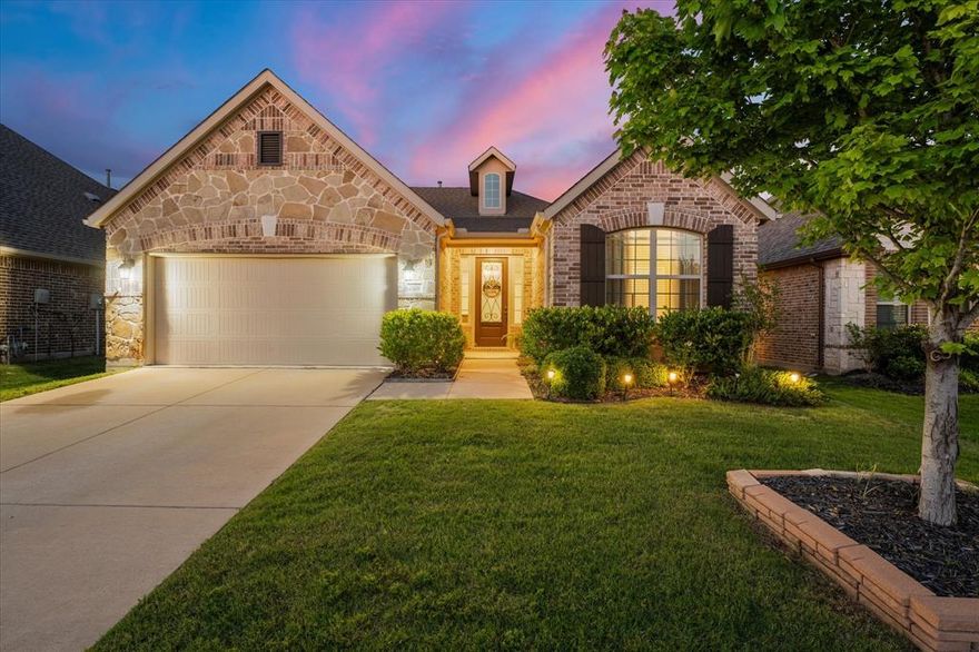 Welcome home to this fabulous one-story gem nestled in the highly sought-after master planned community of Trinity Falls in McKinney! Built in 2017, this beautifully designed home offers the perfect blend of warmth, elegance, and functionality—ideal for first-time homebuyers or anyone looking for spacious living in an amenity-rich community. Featuring 3 bedrooms, 2 bathrooms, and situated on an oversized lot, this home is loaded with upgrades throughout. Step inside to gorgeous hardwood floors flowing seamlessly through the open-concept floor plan, creating an inviting space perfect for everyday living and entertaining. The dreamy kitchen is every chef’s delight with upgraded appliances, abundant cabinetry, and a layout that opens beautifully to the spacious living and dining areas. The stunning laundry room features custom new cabinetry for both style and convenience. Retreat to the oversized primary suite complete with charming bay windows, a huge walk-in closet, and a spa-like bathroom featuring a spacious walk-in shower. The split-bedroom floor plan provides privacy and flexibility for guests or family members. Enjoy peaceful evenings year-round on the screened-in back patio, complete with an electric screen system on one side allowing you to open up the space and enjoy the beautiful backyard. From the gorgeous landscaping in both the front and back yards to the elegant wrought iron front door, every detail of this home has been thoughtfully designed. Living in Trinity Falls means enjoying incredible amenities including community pools, parks, scenic nature trails, playgrounds, an amenity center, and endless opportunities for outdoor fun and relaxation. This move-in ready home truly has it all—style, comfort, upgrades, and an unbeatable location. Come see why you will LOVE this HOME!