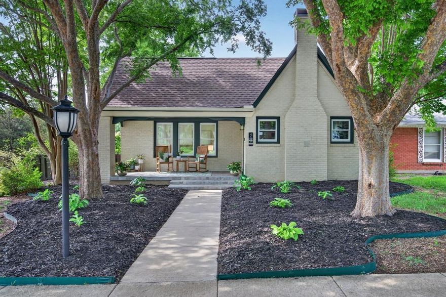 Welcome home to this fully renovated charmer in Arlington Heights!  This 1937 brick Tudor sits on a large corner lot with a detached 2 car garage, multiple outdoor living areas, professional landscaping, fully fenced and lighted outdoor space near major roads, but on a street with very little car traffic. The covered front porch invites you to bring a coffee, a glass of wine and a good book, sit under the canopy of mature shade trees, watch neighbors strolling by.  Inside, this home has been professionally renovated to the highest standards with new plumbing, new electrical, new HVAC, updated energy efficient windows and new roof. Newly renovated and expanded kitchen with quartz counters, 36 in gas chef's range, pot filler and solid wood cabinetry. Custom high end marble wall tile.  Beautifully refinished, pristine nearly 90-year wood floors add character and warmth throughout. Open concept living space with very private bedrooms. Every room boasts multiple windows bringing in natural light that is seldom found in homes of this era.  Luxury primary bedroom suite built with privacy in mind boasts amazing custom walk in closet and new spa like bath with marble shower and vanity wall.  Bonus sunroom can be used as office space, garden room or a Zen like space for escape and relaxation. Rare 2 car garage with bonus storage workshop space. New irrigation system for easy landscape care.  Just minutes from The Bricks on Camp Bowie by car or on foot. Easy access to Downtown, Central Market, TCU, Dickies, Clear Fork and all Fort Worth has to offer! All within the very peaceful and historic Arlington Heights neighborhood with mature trees, and sidewalks for morning and evening walks. EVERYTHING you can think of has already been done - all you need to do is move in and add your story to the 90 years that preceded you!