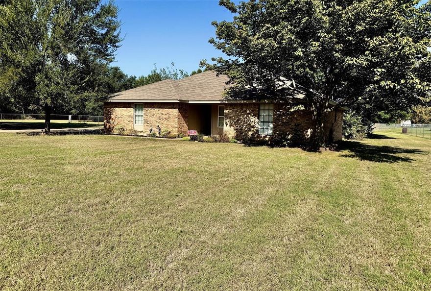 Welcome to your country escape — just minutes from city conveniences!
This beautifully remodeled 3-bedroom, 2-bath home sits on nearly an acre, offering both space and privacy with NO HOA. Step inside to a split-bedroom layout featuring luxury vinyl flooring, fresh paint, updated countertops, stylish accent walls, and thoughtful upgrades throughout.

The spacious living room is perfect for gatherings, and the side-entry garage adds convenience and curb appeal. The inviting family room, complete with a wood-burning fireplace, sets the perfect scene for cozy winter nights or holiday celebrations. The charming kitchen ties it all together, making this home both functional and full of character. Co-Op Utilities are offered through Bethesda Water Supply Corp and United Cooperative Service and have good rates. Outside city limits tax savings.