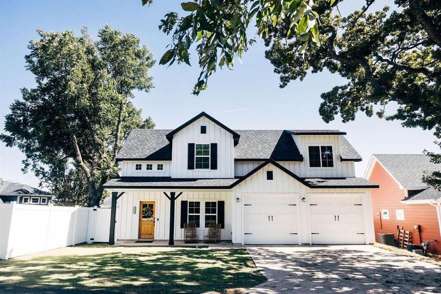 Discover this stunning, one-of-a-kind custom Modern Farmhouse, showcasing an elegant all-white exterior with black trim, ideally located just behind Lakeview Marina on Lake Lewisville with  No HOA! Enjoy a relaxing 4–5 minute stroll to the marina, boat slips, fishing pier, playground, swimming areas, and scenic nature trails.

Inside, soaring ceilings and abundant natural light fill the home, creating bright and welcoming gathering spaces. The thoughtfully designed layout includes a spacious office at the entry, an open-concept floor plan, and exceptional craftsmanship throughout. The kitchen combines modern elegance with warm farmhouse charm, featuring crisp white cabinetry, natural wood accents, and a roomy walk-in pantry. The bathrooms showcase high-end finishes and a luxurious freestanding soaking tub, while the spacious two-car garage offers ample storage.

Don’t miss the charming hidden storage or playroom tucked inside Bedroom 2’s closet—a fun and functional surprise perfect for kids or creative use.

Step outside to enjoy lush full sod landscaping, a large covered front porch, a covered back patio, and a low-maintenance 6-foot white vinyl fence.

All this, and you’re still just minutes from I-35 and Eldorado Parkway, providing an easy and convenient commute.