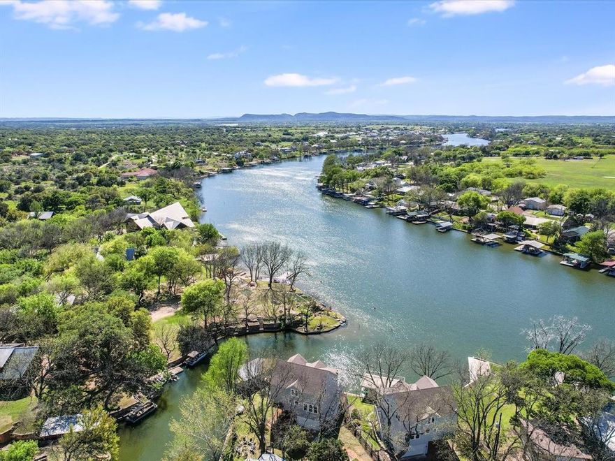 TRUE LAKEFRONT LIVING on the highly desired Colorado Arm & open water on Lake LBJ. This amazing prop is full-on-waterfront & sides a beautiful Cove. With over 116ft of waterfront access you have countless opps for fun. The 2015 custom Hill Country mod transitional hm has recently been completely re-painted & new lux vinyl wood flooring upstairs was just installed. This hm boasts a lg kit w-designer tile, quartz counters, an oversized island, a lg pantry, laundry rm w-WD & addl storage rm. There are 3 bdrms & 3 full baths, flex rm & spacious study. The prim suite is on the 1st level & boast a newly installed closet system. The bathrm is gorgeous w- custom furn vanities. linen space & a very lg walk in shower. All furnishings & appl convey w- the house inc bedding, dishes, & other kitchen items. There is an oversized garage & a covered outdoor entertaining space where outdoor living is a blank canvas. Don't miss the newly installed remote control screens across the front porch. ENJOY!