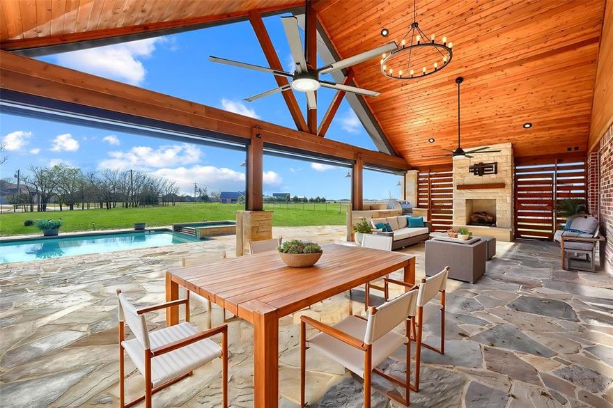 Nearly 2 acres, resort-style pool, outdoor living pavilion, and a 1,200 sq ft shop—this Caddo Mills property offers the perfect blend of luxury, space, and freedom with no HOA and lower taxes. Nestled in the charming community of Caddo Mills, this beautifully designed home provides the privacy of country living while remaining conveniently connected to town amenities. With over 2,800 square feet of thoughtfully designed living space, the home balances comfort, style, and functionality.

Inside, rich hand-scraped hardwood floors create a warm and inviting atmosphere. The spacious floor plan features 3 bedrooms, 2.5 baths, two dedicated office spaces, and two dining areas—perfectly suited for today’s flexible lifestyle of working, gathering, and entertaining.

The primary suite is a true private retreat, highlighted by a generous walk-in closet and an adjoining bonus room—ideal for a nursery, private sitting area, second office, or media lounge.

Outdoors is where this property truly shines. A newly built pavilion creates the ultimate entertaining space with a cozy fireplace, built-in grill, refrigerator, and automatic electronic roll-down shades for year-round enjoyment. Just beyond, a sparkling pool and relaxing spa complete the private backyard oasis.

The impressive 1,200-square-foot shop is equipped with multiple voltage options for equipment and projects, plus a convenient toilet area—perfect for hobbies, storage, or workspace.

Located within highly regarded Caddo Mills ISD, an exemplary district known for strong academics, this property offers a rare combination of space, luxury, and lifestyle.

Homes with this level of land, outdoor living, and versatility rarely come available—schedule your private showing today.