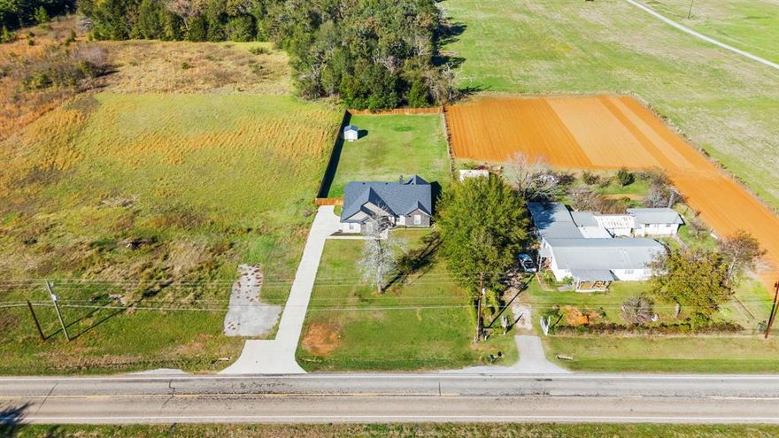 Move in ready home on nearly one acre in highly sought after Bullard ISD just minutes from Tyler. Built in 2021, this custom home offers the modern features buyers search for with the added benefit of space, privacy, and no HOA restrictions.

Inside, the open concept floor plan creates comfortable everyday living with a spacious living room centered around a cozy corner fireplace. Large windows overlook the covered back patio and backyard, bringing in abundant natural light and highlighting the neutral color palette that makes the home feel fresh, clean, and truly move in ready. The neutral interior provides a perfect blank canvas for buyers to personalize their style.

The kitchen is designed for both function and gathering with a gas range, extensive custom cabinetry, generous storage, and a dedicated coffee nook. The open layout connects seamlessly to the living and dining areas, making it ideal for entertaining, daily living, or hosting family and friends.

The private primary suite offers tray ceilings and a spacious ensuite bath with dual sinks, garden tub, and separate shower, creating a relaxing retreat at the end of the day. Two additional bedrooms and a full bath provide flexibility for guest rooms, home office space, or growing household needs.

Step outside and discover nearly one acre of fenced backyard space ready for your vision. The large covered patio creates the perfect starting point for a future outdoor living area, summer entertaining space, or backyard retreat with room for a pool, garden, play area, or workshop. With space this size, the possibilities are wide open.

Additional features include excellent storage throughout the home, extra insulation for energy efficiency, a spacious laundry room, two car garage, and aerobic septic system.