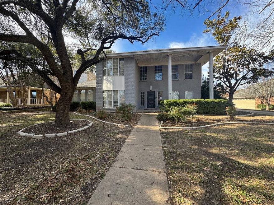 Stately two-story Colonial Revival-style brick home offering 4 bedrooms, 3 full baths, and a 2-car garage, located in an established neighborhood with beautiful mature trees. The home features multiple living and dining areas, a formal entry, and two private flex rooms ideal for home offices, studies, or hobby spaces — including one with extensive built-in cabinetry. An upstairs Florida-style enclosed sunroom with large windows provides a versatile bonus area that can be used as a game room, home gym, or additional living space. The spacious traditional floor plan is designed for both everyday living and entertaining, with all bedrooms located upstairs for added privacy.  All measurements, square footage, and school information are approximate and should be independently verified. Property is owned by the Secretary of Veterans Affairs and is being sold AS-IS.
