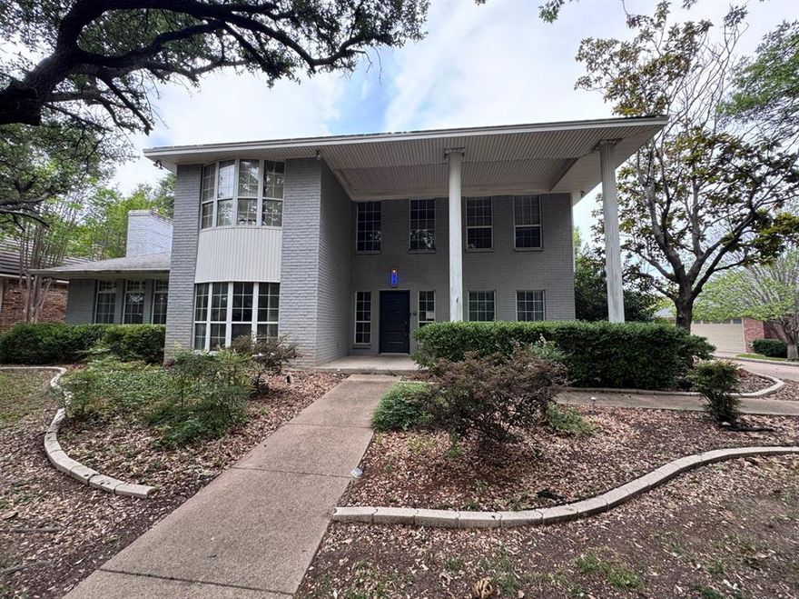 Stately two-story Colonial Revival-style brick home offering 4 bedrooms, 3 full baths, and a 2-car garage, located in an established neighborhood with beautiful mature trees. The home features multiple living and dining areas, a formal entry, and two private flex rooms ideal for home offices, studies, or hobby spaces — including one with extensive built-in cabinetry. An upstairs Florida-style enclosed sunroom with large windows provides a versatile bonus area that can be used as a game room, home gym, or additional living space. The spacious traditional floor plan is designed for both everyday living and entertaining, with all bedrooms located upstairs for added privacy.  All measurements, square footage, and school information are approximate and should be independently verified. Property is owned by the Secretary of Veterans Affairs and is being sold AS-IS.