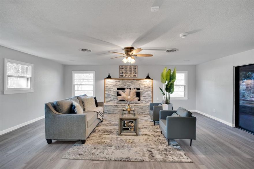 This house comes with a REDUCED RATE as low as 5% APR 5.424% as of 12.11.2025 through List & Lock™. This is a seller paid rate-buydown that reduces the buyer’s interest rate and monthly payment. Terms apply, see disclosures for more information. 
Check out this beautifully updated 3-bedroom, 2-bath home with 2,154 sq ft of comfortable living space. You’ll love the great curb appeal, featuring fresh exterior paint and a welcoming covered front porch.
Inside, enjoy brand new luxury vinyl flooring, fresh paint, updated light fixtures, doors, fans, and new baseboards throughout. The kitchen shines with new cabinets, countertops, island, a double oven, and stainless steel appliances — perfect for anyone who loves to cook and entertain.
With two spacious living areas, a cozy wood-burning fireplace, and plenty of room to relax, this home offers both comfort and flexibility. 
Outside, you’ll find a large fenced backyard, covered patio, carport, and storage shed — everything you need for outdoor living and extra storage.