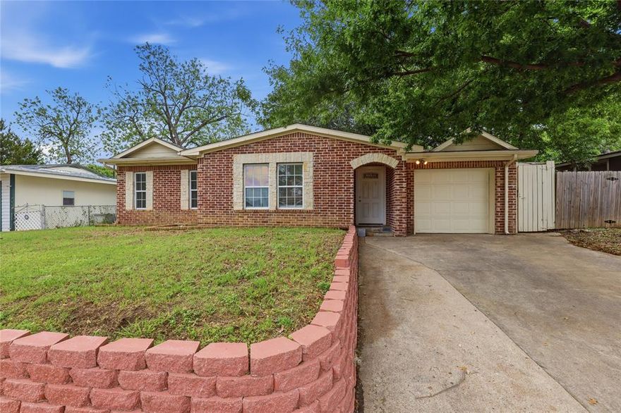 Well-maintained beauty in the heart of Arlington! So close to education and entertainment hubs of UTA, AT&T Stadium, and Globe Life Field. The brick and stone front welcomes you into this polished 3 bed, 2 bath home that has been nicely updated and is move-in ready! Two generous living areas and dining area open to a beautiful kitchen with crisp white quartz counters and tiled backsplash. Full size utility room is right off the kitchen and adjacent to the garage entry. Great bedroom sizes, and primary bedroom has an ensuite bath and large walk-in closet! Closets and storage space are ample throughout the entire home. Even the yard will impress as bigger than expected. The covered back patio makes a great place to have coffee and escape the sun. The list of upgraded finishes is extensive: LVP flooring throughout, ceiling fans and lots of recessed lighting, wood burning fireplace, stainless appliances, fully tiled baths with separate toilet areas, one car garage space, stone retaining wall in front yard. This house is terrific - come make it your reality!