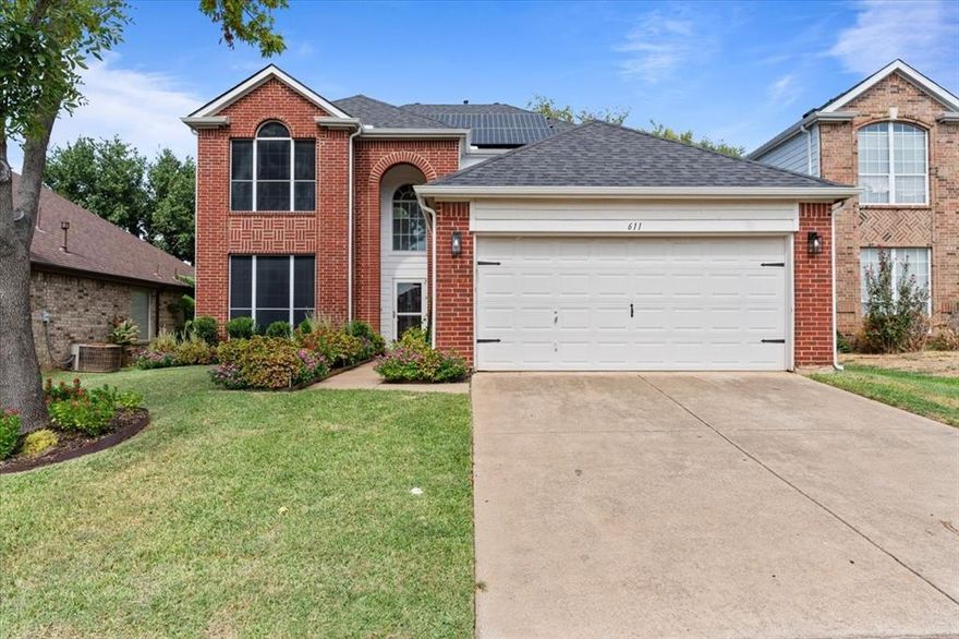 Welcome to this beautiful two story traditional nestled just steps to Lake Lewisville. A well manicured exterior invites you inside this spacious 4 bedroom, 2.5 bath home with soaring 20 ft. ceilings in the foyer. Make your way into the light filled living room highlighted by a cozy fireplace. Enjoy whipping up a home-cooked meal in the fully equipped kitchen with stainless steel appliances and breakfast bar. A wonderful flex room is situated off the kitchen and could be used as a home office, formal dining room or play room for kids. The spacious primary bedroom is thoughtfully located on the first floor + offers a large en suite bath and walk-in closet. Create memories to last a lifetime with friends + family upstairs in the expansive game room with plenty of space to house a pool table. With solar panels already in place, you'll reap the benefits of energy efficiency & savings. This home is ideal for those who enjoy lake life living and all that it has to offer.
