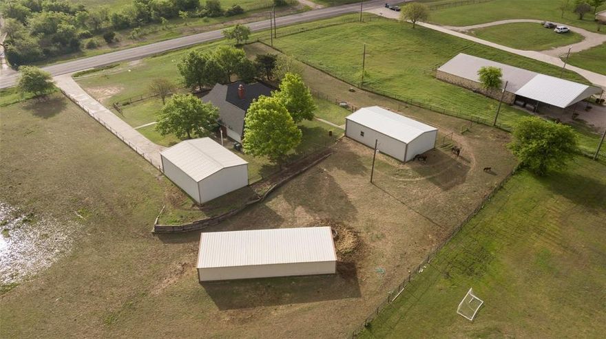 Unique property with home, shop and large loafing shed and RV parking.  This property can be used for residence as well as run a trade business using shop and horses and livestock are allowed.